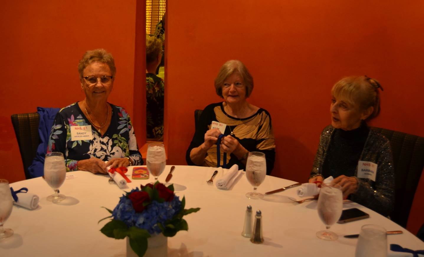 A group of women sitting at a table

Description automatically generated