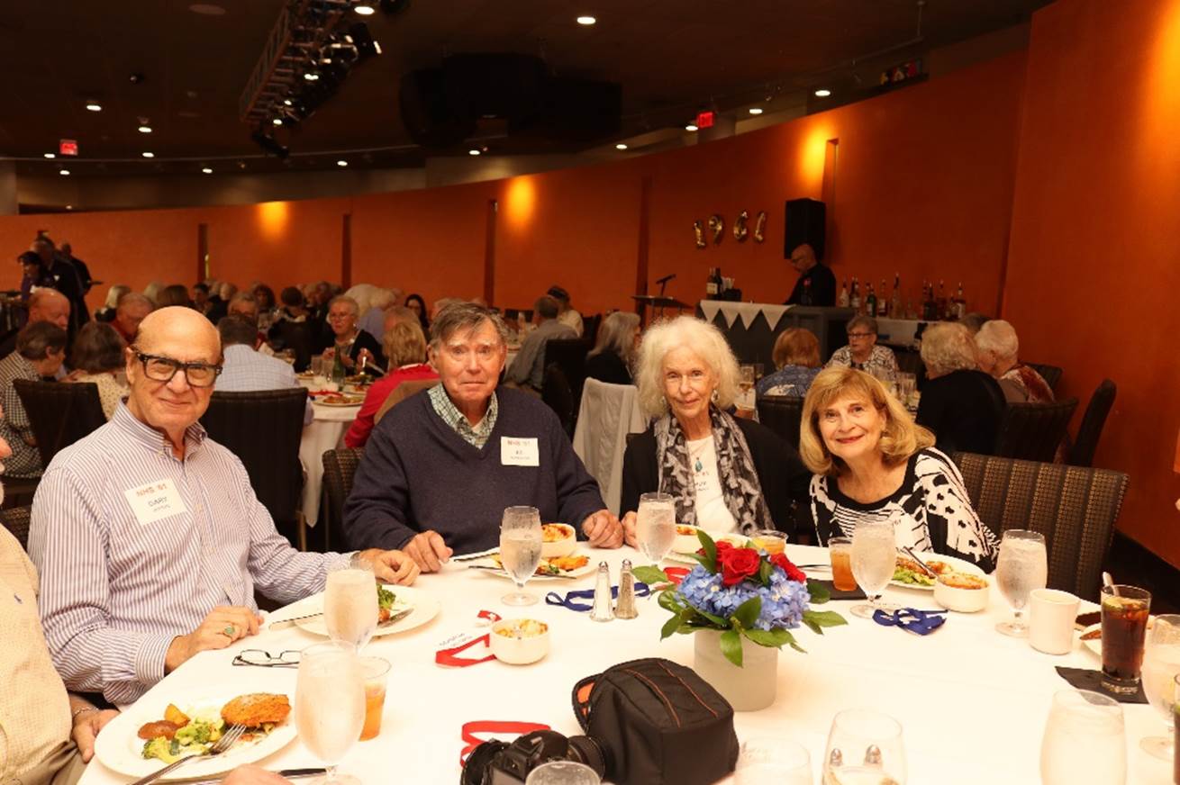 A group of people sitting at a table

Description automatically generated